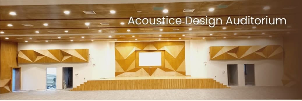 The Attock auditorium with faceted timber acoustic panels to the side walls and stage wall, recessed ceiling lighting and a tiered stage front.